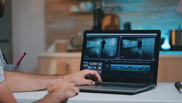 Videographer working remotely editing video footage